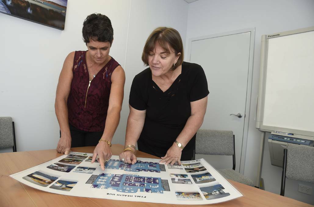 Australian first: Peel Youth Medical Service's Eleanor Britten and Denise Puddock examining plans for the Youth Health Hub. Photo: Richard Polden.