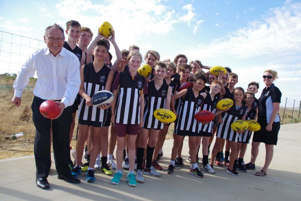 Mandurah MP David Templeman with players from the North Mandurah Football Club, who hope to find a home after a commitment from WA Labor to build a sports facility at the new Lakelands SHS. Photo: Jess Cockerill.