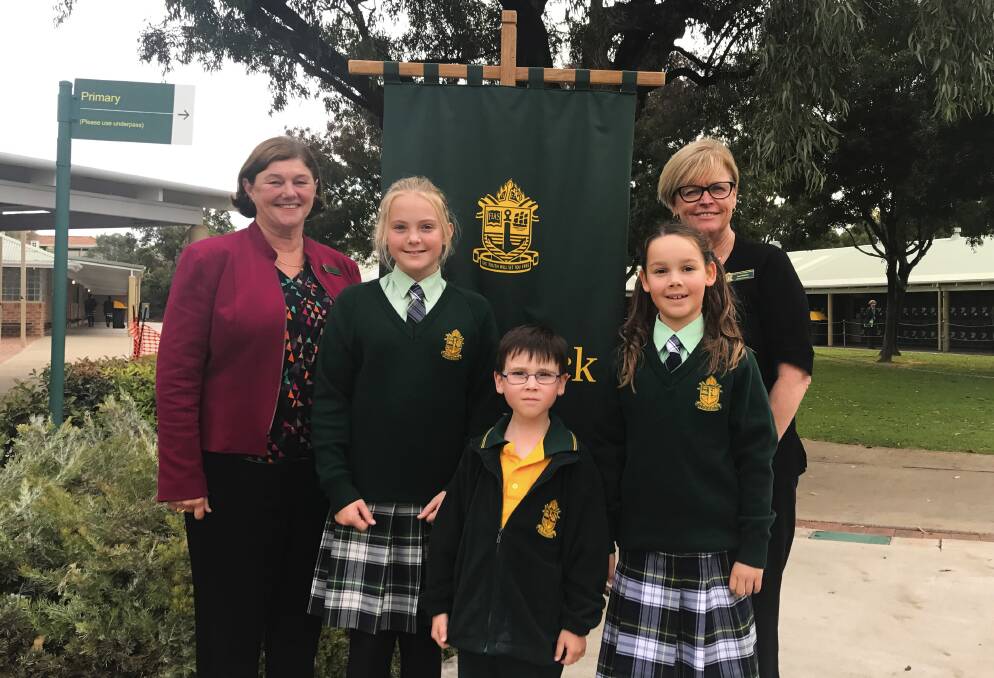 Expanding: Frederick Irwin Anglican School principal Kerry Robertson with primary students and Head of Primary Sue Skehan. Photo: Supplied.