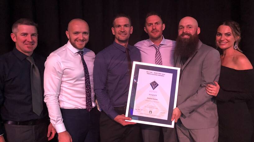 Winners are grinners: The team at Cachet homes celebrate their win at the awards night. Photo: Supplied.