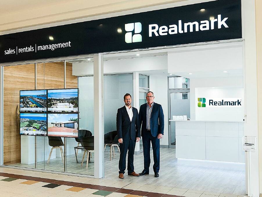 Award winning: Realmark Mandurah co-owners and selling directors Simon Wroth and Greg Penn at the Realmark Mandurah office in the Miami Plaza Shopping Centre, Falcon. Photo: Supplied.
