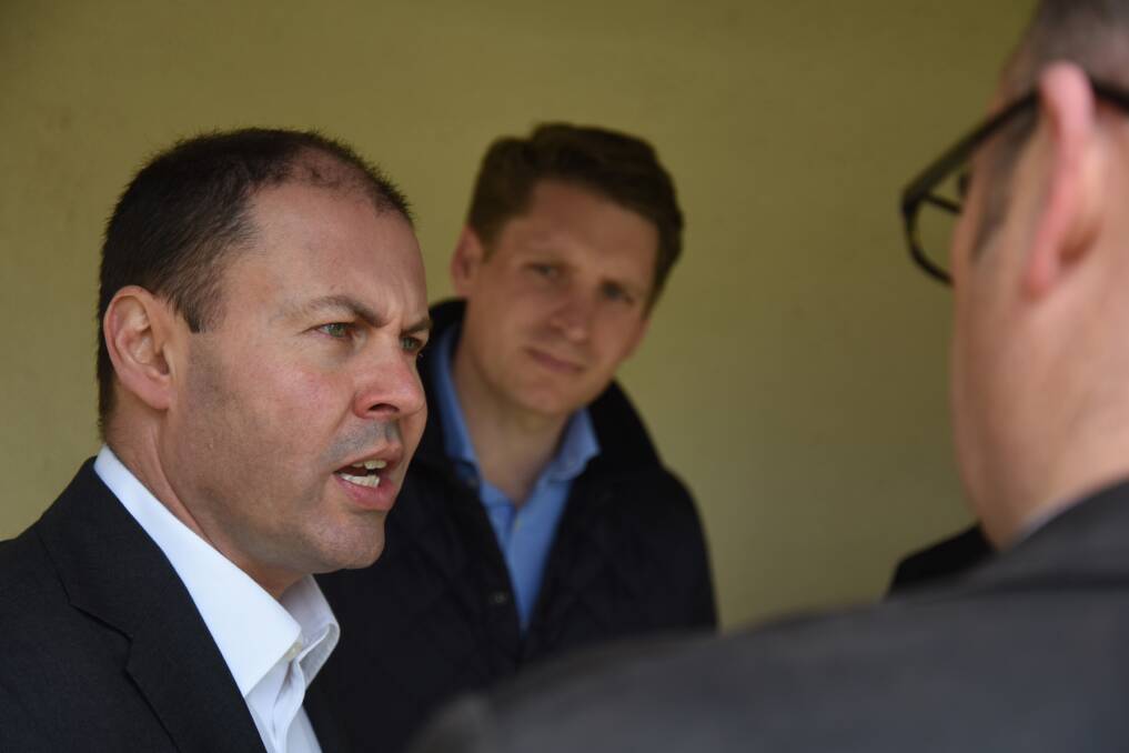 On the front foot: Federal environment minister Josh Frydenberg, pictured with Canning MP Andrew Hastie, calls on the City of Mandurah to get the Falcon shark barrier built. Photo: Marta Pascual Juanola.