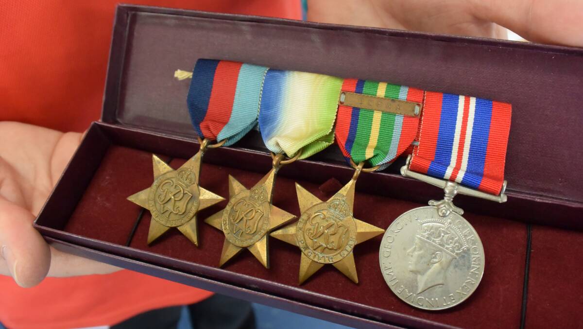 Lost and found: These medals (and their case) were found in a Salvation Army donations bin. Do you know who they belong to? Photo: Nathan Hondros.