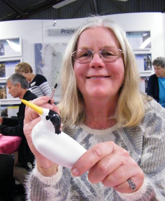 Sanctuary: Cherilyn Corker painting a Fairy Tern. Photo: Supplied.