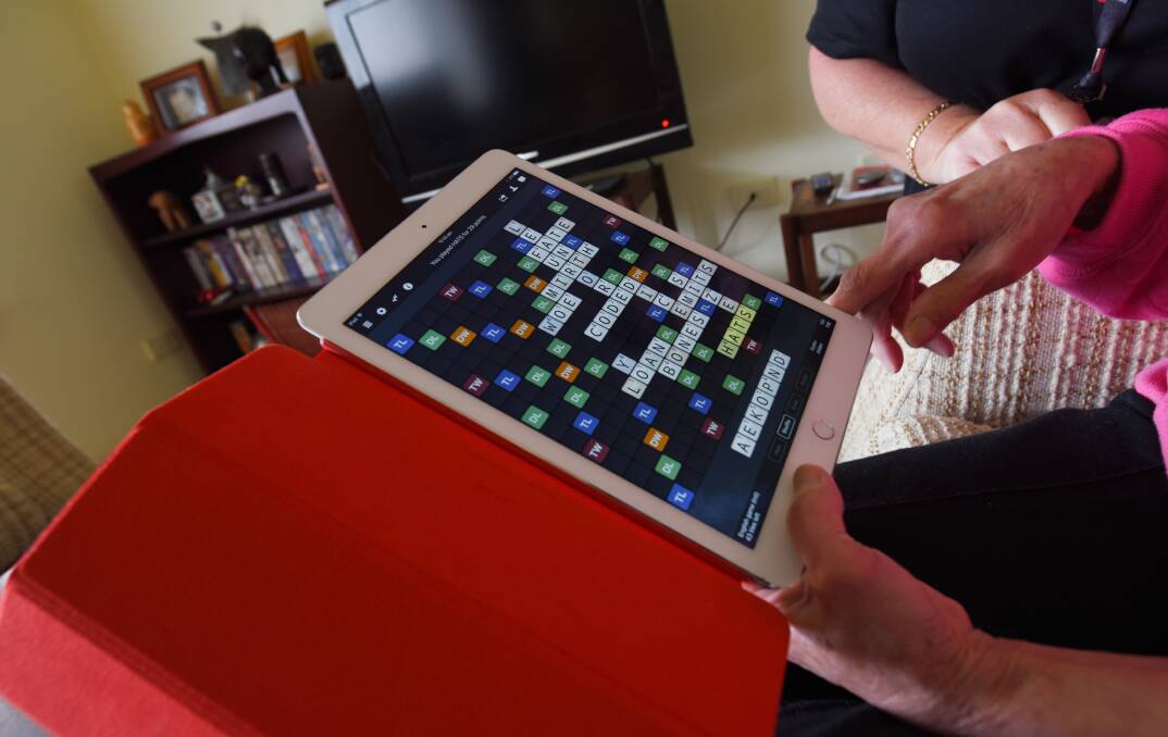 Going 2.0: Meadow Springs resident Lily Deverill loves playing Scrabble with her son and listening to music videos on Youtube. Photo: Marta Pascual Juanola.