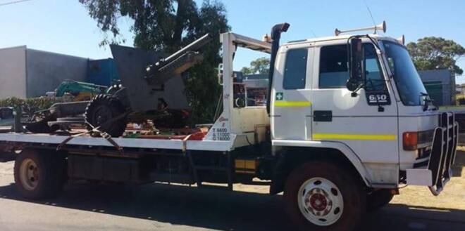 Theft: The stolen tray top truck, registration 1ARB166, is being used to steal other vehicles. The thieves pretend it's a repossession job. Photo: Facebook. 