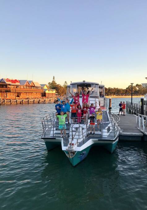A group of children that were on board the Christmas Lights Cruise through the Port Mandurah canals. 