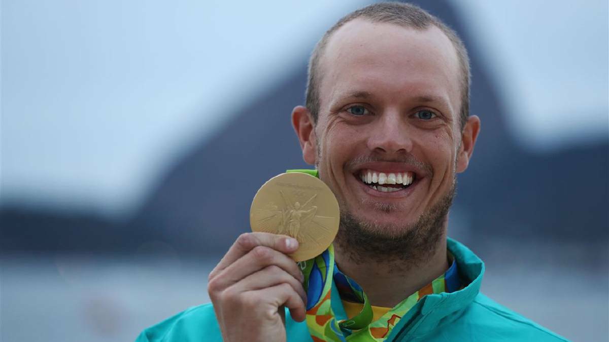 Tom Burton of Australia celebrates winning the gold medal in the Men's Laser class on Day 11 of the Rio 2016 Olympic Games at the Marina da Gloria on August 16, 2016 in Rio de Janeiro, Brazil. Photo: Clive Mason/Getty Images