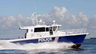 An upturned catamaran found drifting off the Mandurah coast on Sunday morning has prompted a search by local water police. Pic: WA Water Police.