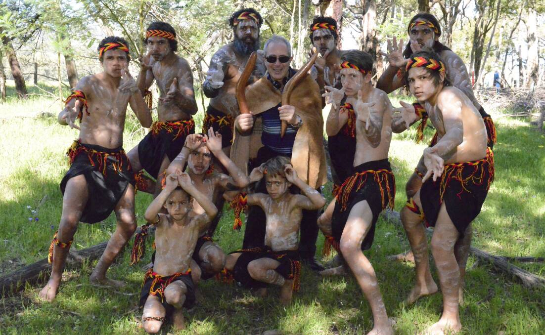 Local culture: Three Summers writer and director Ben Elton (centre) with members of the Bindjareb Middar Dance Group, which features in the locally shot film.