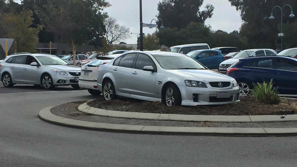 An enterprising driver remedying the often-frustrating traffic issues on Sholl Street by parking right in the middle of a roundabout. Photo: Supplied. 