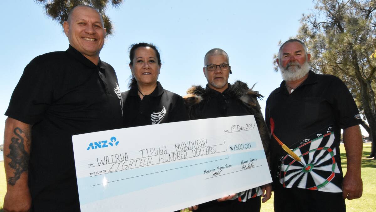 Wairua Tipuna's Kereama Nepia-Chalmers and Whaea Jo Matthews accept an $1800 donation from Bindjareb-Murray Darts Association's Maurice Heta-Tohu and Ashley Watts. Photo: Justin Rake.