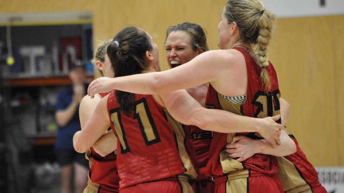 The Magic celebrate after winning their way into the final. Photo: Kate Hedley.