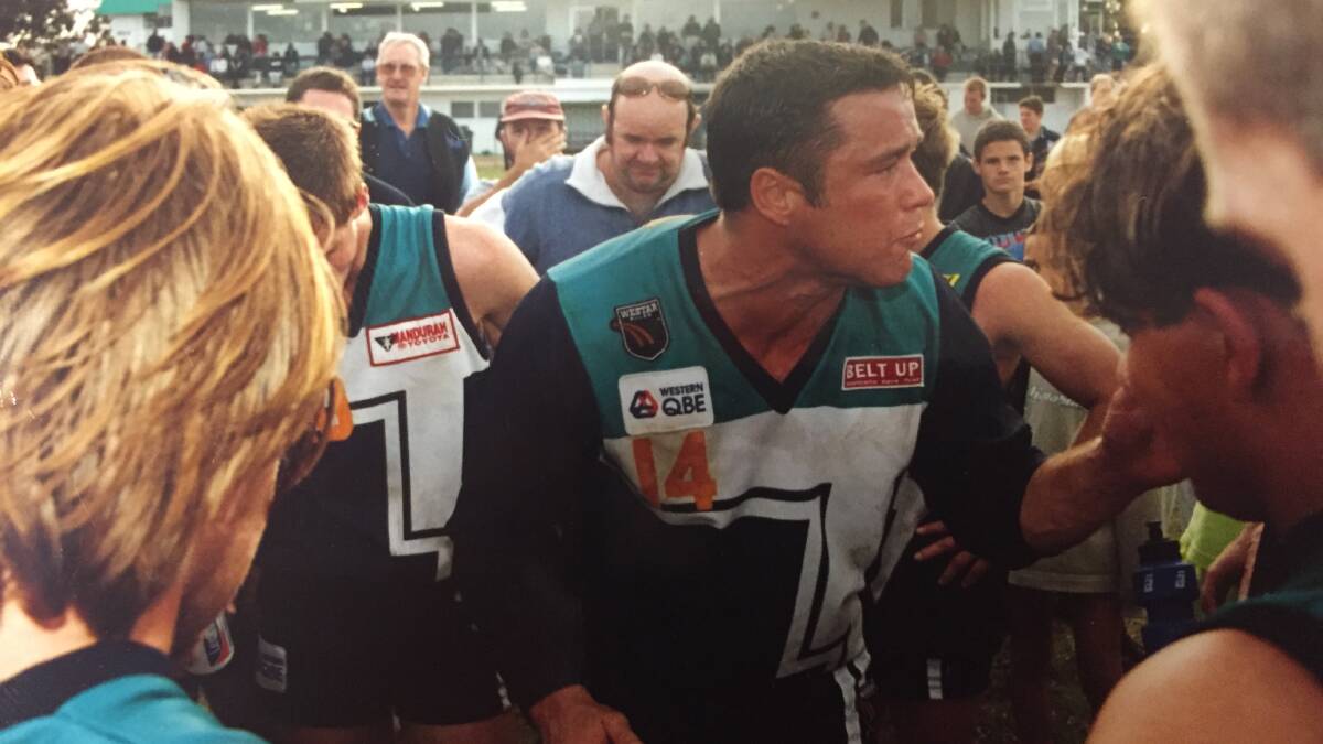 Scott Simister tries to fire up the huddle in a match in Peel Thunder's inaugural season. 