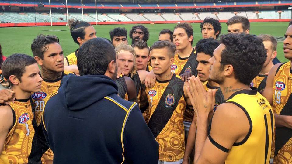 Barry Lawrence pictured coaching his side at the MCG in the Footy Means Business program. Photo: supplied.    