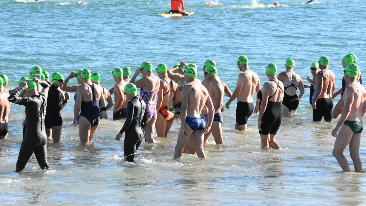 A record crowd of swimmers hit Town Beach for the Open Water Swim Series. Photo: Justin Rake.