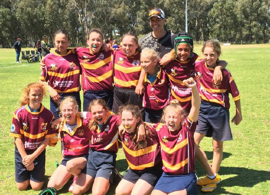 South Halls Head Primary School's girls rugby team celebrate a win in the regional rugby tackle competition. Photo: Supplied.