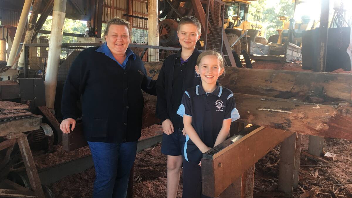 Dwellingup Sawmill office manager Jennifer Bradburn with Carcoola Primary School students Austin and Lily Lamb. Photo: Supplied.