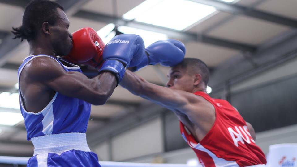 Alex Winwood (red) lands a jab against Maxi Mangea. Photo: Boxing Australia.