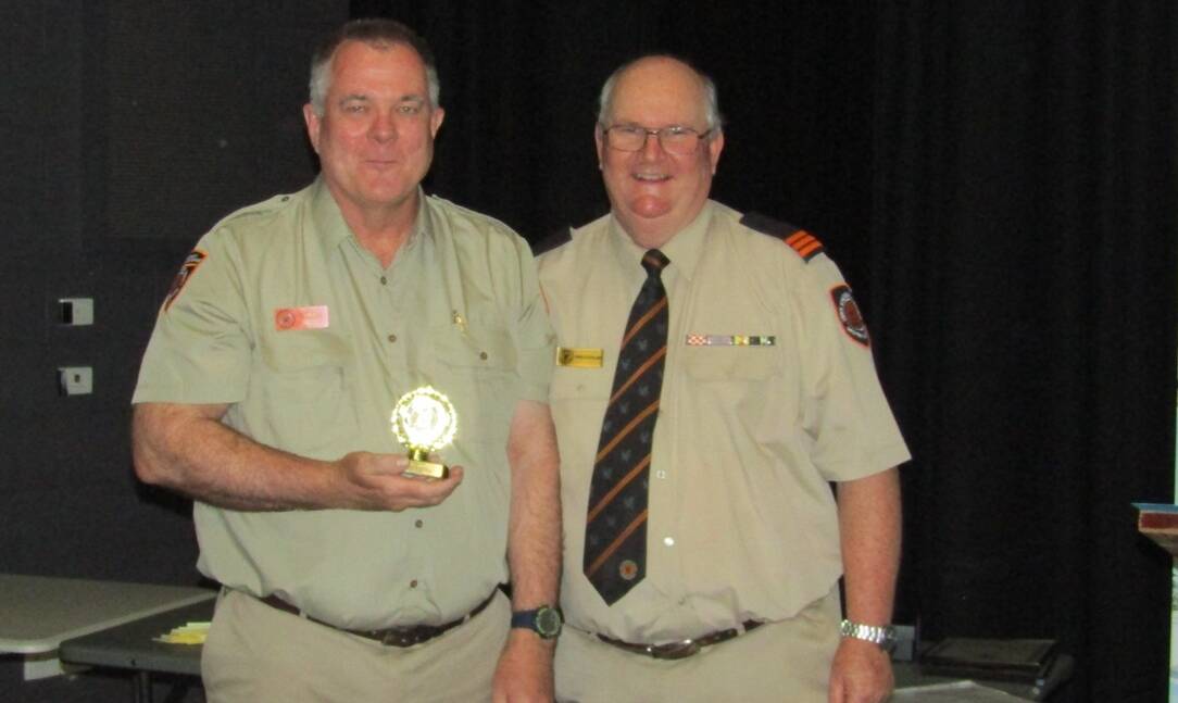 Paul Dwyer is presented the Outstanding Service for Finance and Administration Award by unit manager Chris Stickland. Photo: Bec Burns/Mandurah SES.
