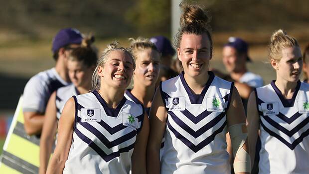 Former Peel Thunderbirds Demi Okely and Tayla Bresland were all smiles after the game. Photo: Fremantlefc.com.au  