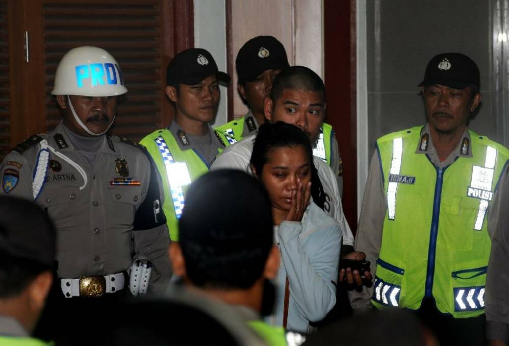 Andrew Chan's brother Michael Chan and Andrew Chan's  girlfriend Febyanti Herewila moments after Indonesian police refused their request to see Chan before his transfer.   Photo: Allan Putra