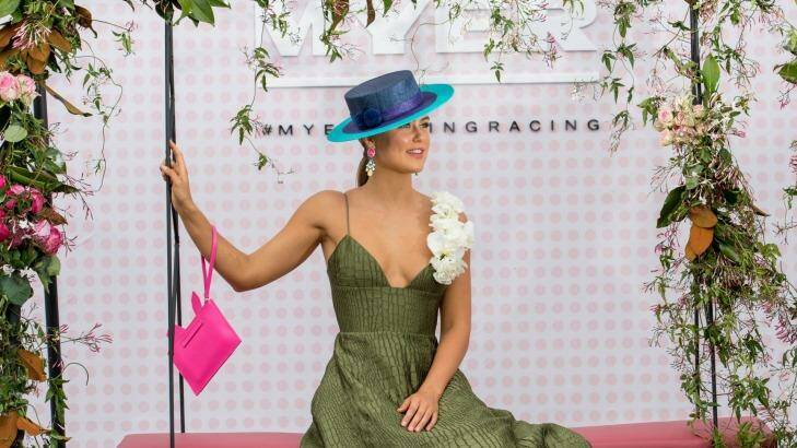 Myer fashions on the field ambassador Stephanie Smith wearing an Alex Perry dress and Lisa Tan hat at the launch of the competition on Wednesday. Photo: Penny Stephens