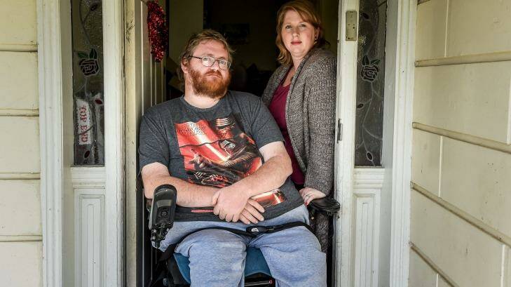 Shane Barnbrook, with wife Sarah, is suing two hospitals for negligent care that left him a paraplegic. Photo: Justin McManus