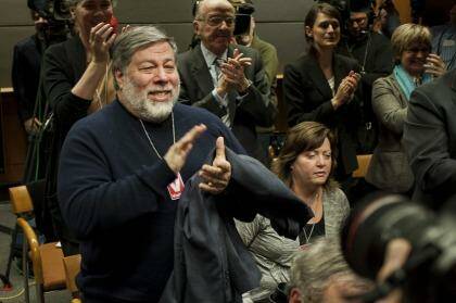 Steve Wozniak, co-founder of Apple Inc., applauds during the meeting to vote on internet regulations at the Federal Communications Commission (FCC) headquarters in Washington.  Photo: Pete Marovich