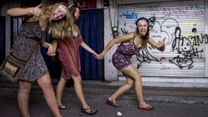 School leavers heading home through the back streets of Kuta after a big night of partying. Photo: Jason Childs 