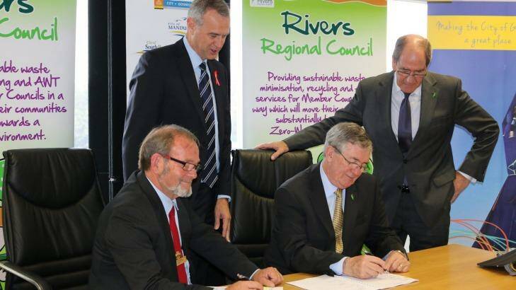Local Government Minister Tony Simpson and Rivers Regional Council chief executive Alex Sheridan witness Gosnells Mayor Dave Griffiths and RRC chairman Ron Hoffman sign the contract what will end eight councils' dependence on landfill.  Photo: Supplied