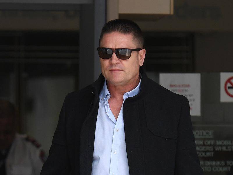 Mark Bladen has been fined $1000 for choking a teenage boy he claims was bullying his stepdaughter.
