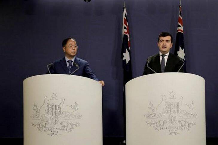 Yuhu Group CEO Huang Xiangmo and Sam Dastyari at a press conference for the Chinese community in Sydney on the 17th of June. Photo: supplied .