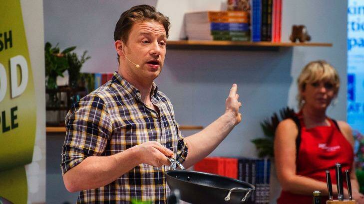 Jamie Oliver cooking in the Woolworths Fresh Food Dome  Photo: Christopher Pearce