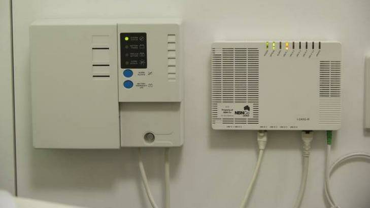 The NBN power supply unit with a backup battery, left, that is causing headaches.