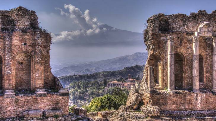 Sicily, Italy: The ancient theatre at Taormina has a stunning backdrop of Mt Etna. Photo: iStock