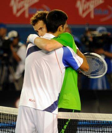 Novak Djokovic and Andy Murray embrace after the men's final in 2011. Photo: Sebastian Costanzo