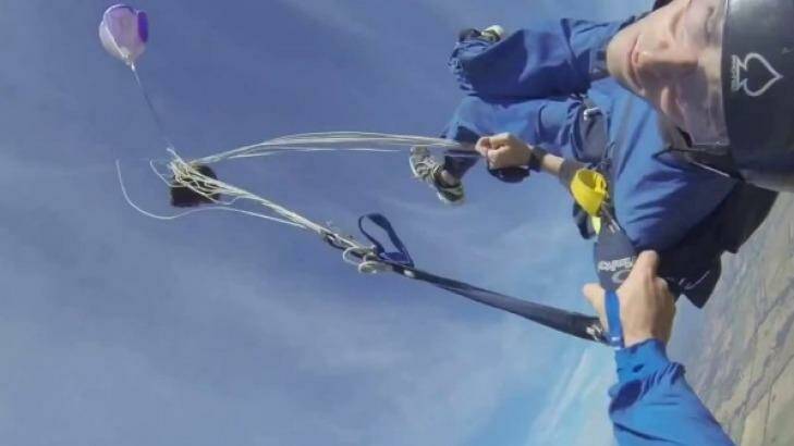 Shortly after the ripchord is pulled for him the trainee skydiver regains consciousness Photo: YouTube