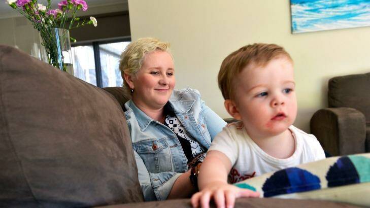 Caroline Weston, with son Ted, risked recurrent cancer.  Photo: Joe Armao
