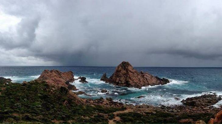 This photo of weather rolling in to Sugarloaf Rocks in WA's South West was taken by Steven Brooks. Photo: perthweatherlive.com