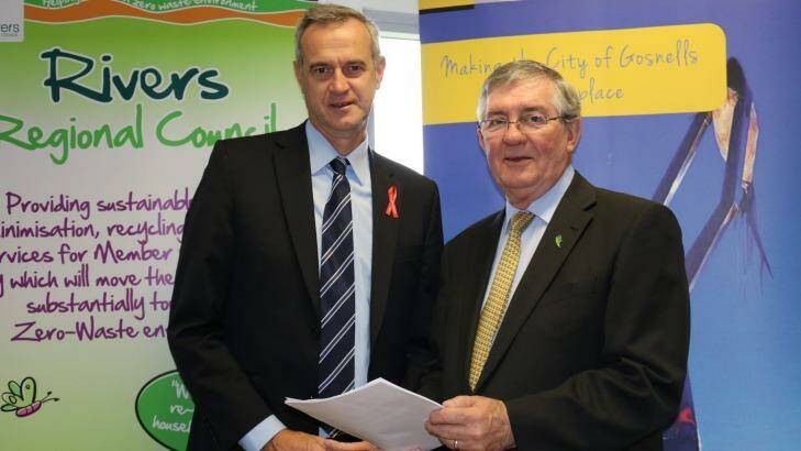 Local Government Minister Tony Simpson with RRC chairman Ron Hoffman, whose signing of the contract marked one of his last actions as a public servant.  Photo: Supplied