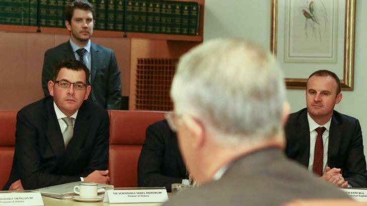 Victorian Premier Daniel Andrews and ACT Chief Minister Andrew Barr listen Mr Turnbull addresses COAG. Photo: Alex Ellinghausen