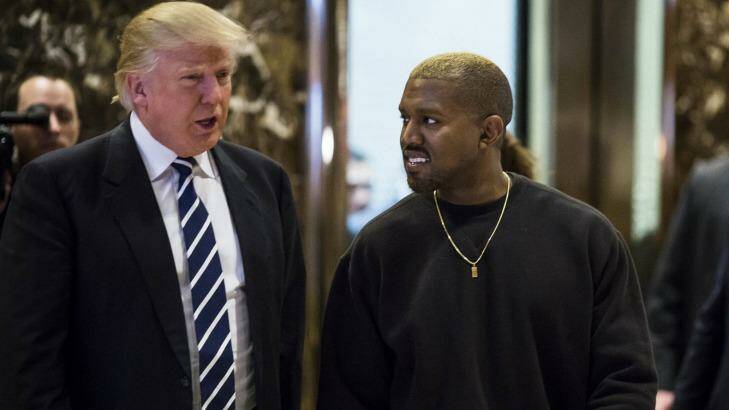 Donald Trump, left, and Kanye West arrive in the lobby of Trump Tower in New York, U.S., on Tuesday, December 13, 2016.  Photo: John Taggart