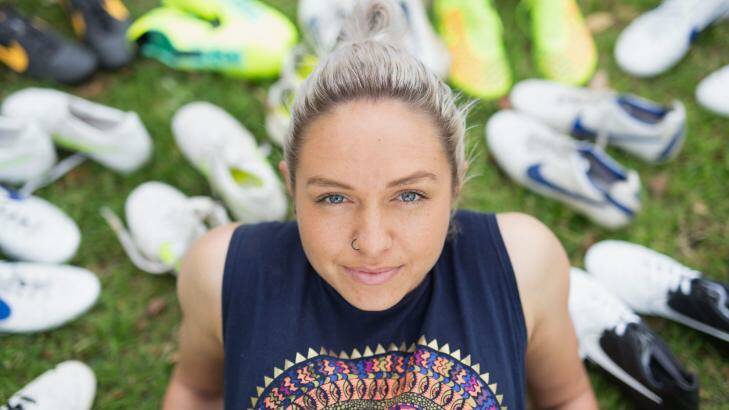 Matildas star Kyah Simon and some of her soccer boots collected over the years. Photo: Cole Bennetts/Getty Images