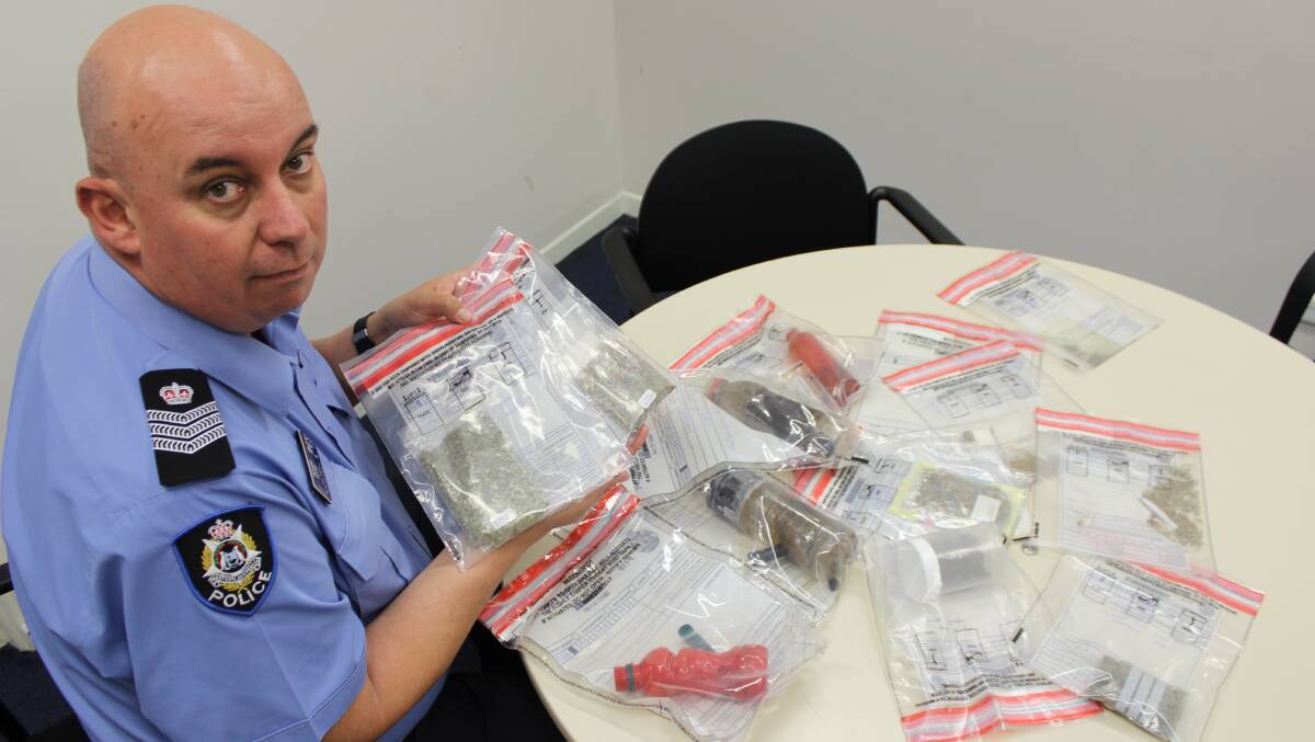 An intoxicated and irate woman called the Esperance police to complain just how hard it was to buy marijuana in the town. Pictured is Senior Sergeant Richard Moore with some of the cannabis taken off the streets in the last month.