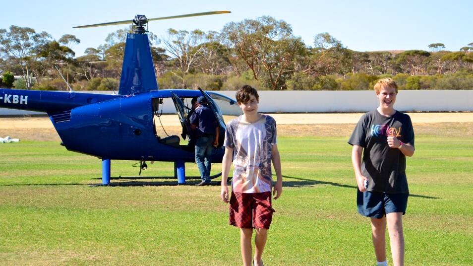 Denver Simmonds and Declan Hogan pleased with their helicopter joyride. Photo: Megan Simmonds.