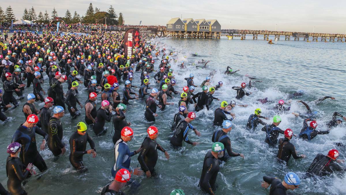 Competitors for the 2015 Busselton Ironman event hit the water just before 6am. 