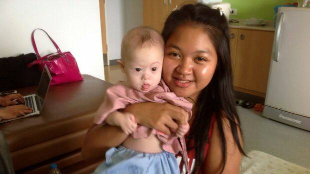 Thai surrogate mother Pattaramon Chanbua poses with baby Gammy in Bangkok, Thailand, last year.  Photo: Handout