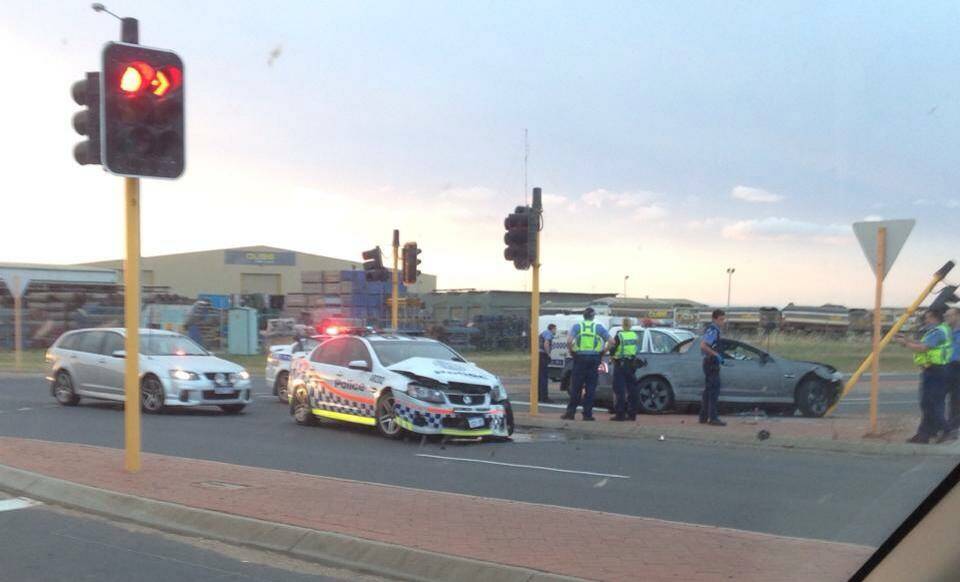 Police have charged a 22-year-old driver from Australind with a number of offences after a high speed chase ended when a stolen vehicle collided with a police car. Image: Natasha Young. 