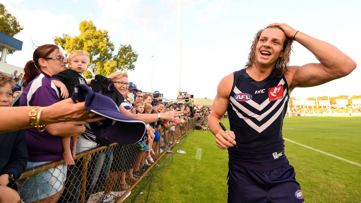 Nat Fyfe of the Fremantle Dockers celebrates with the crowd after the 2016 NAB Challenge match between the Fremantle Dockers and the Richmond Tigers at Rushton Park, Mandurah on February 19, 2016. Pic: Daniel Carson/AFL Media/Getty Images